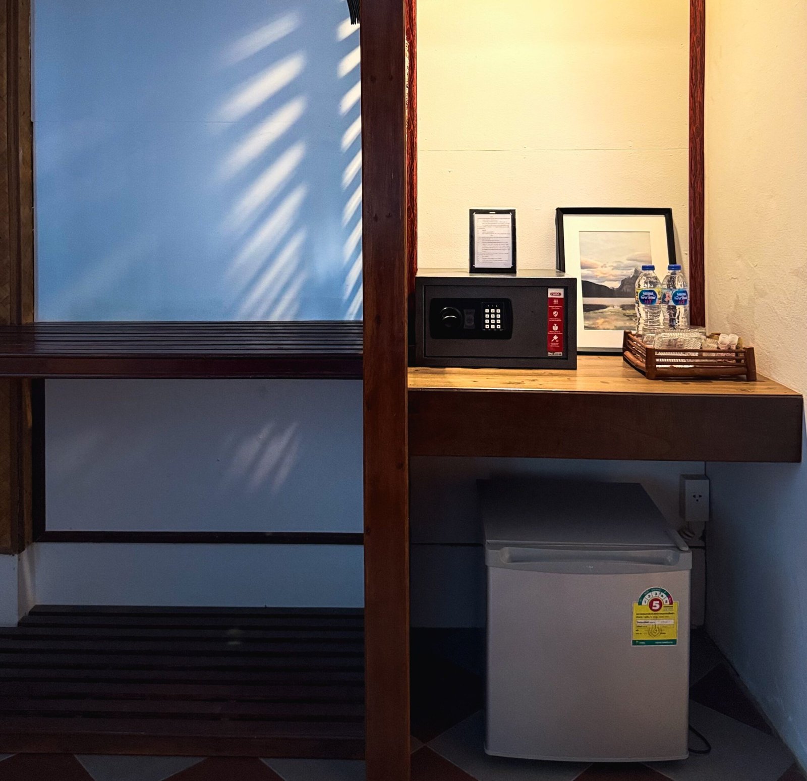 In-room amenities including safety box, drinking water and refrigerator at Pansand Resort